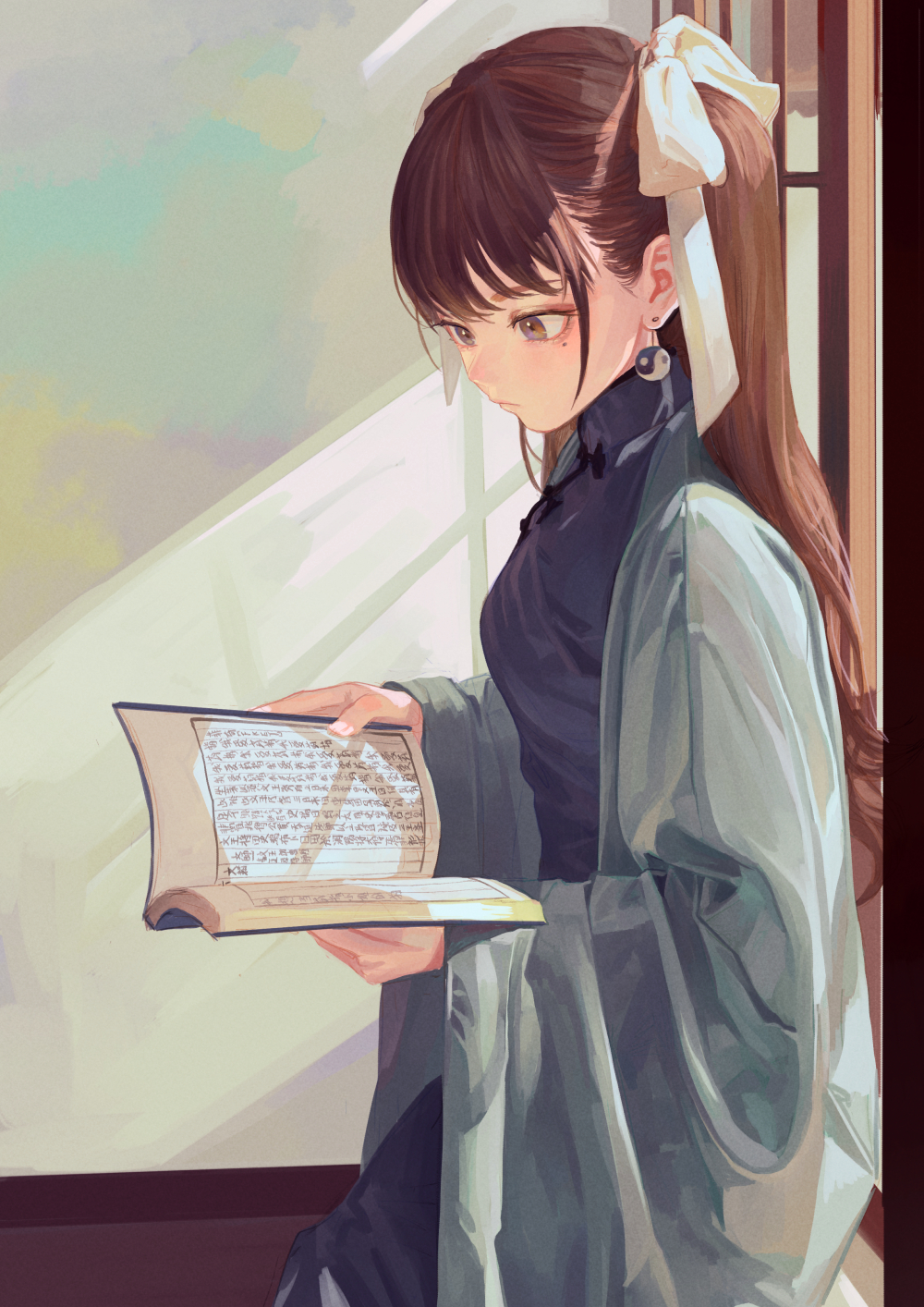 an anime cartoon of a girl with fair skin, brown hair in pigtails held with white ribbons, and wearing long earrings, is standing in front of a window, reading a book. she is wearing a dark chinese dress (qipao) covered with a light green robe. light streams in through the window and illuminates the scene.