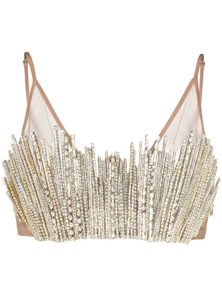 a beige, strappy lingerie top or bra adorned with silver rhinestones or diamanté embellishments. the straps are thin and the cups appear to be made of sheer mesh. long, vertical lines of rhinestones hang from the bottom of the bra.