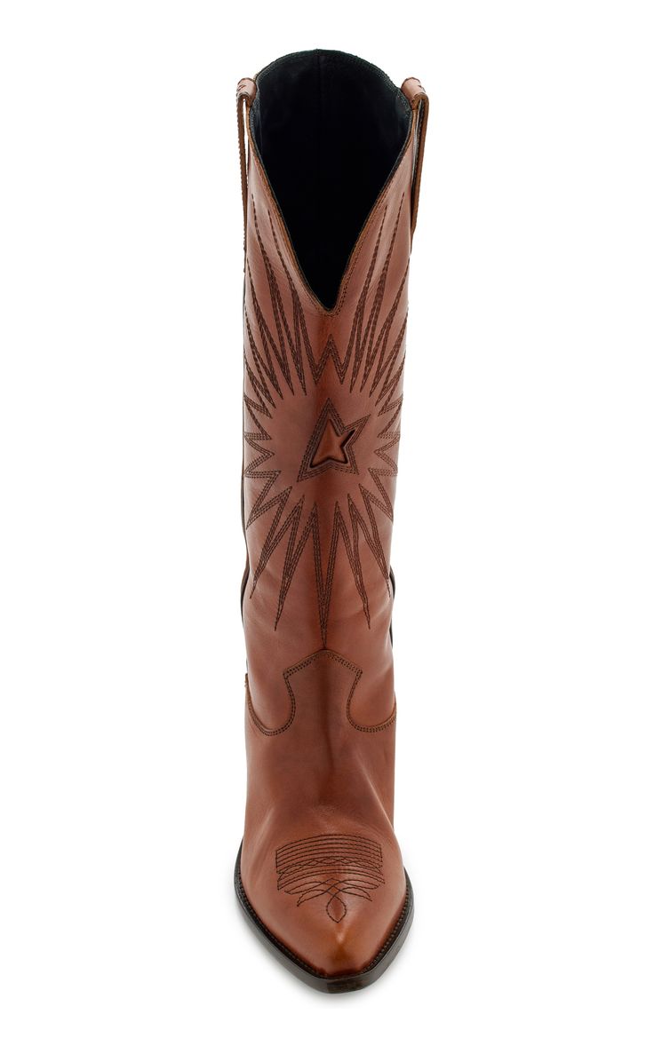 pair of brown leather cowboy boots are displayed in a front view, showcasing their intricate starshaped embroidery and pointedtoe design. the boots are tall, extending above the ankle, and made of a rich, brown leather. the image is set against a white background, making the boots the clear focus of the photograph.  the stitching details are visible, and the leather appears smooth and supple. the interior of the boot is visible at the top, revealing a dark lining.