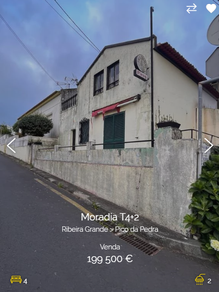 a photo of a house for sale in ribeira grande, azores, portugal. the house is a twostory, grey concrete building with a red tile roof. there are green plants in front of the house. the house has a large window and a door. the house is for sale for 199,500 euros.