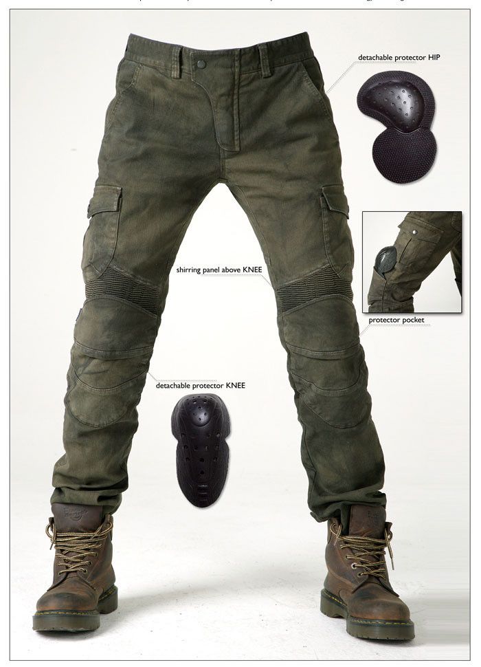 a man is modeling a pair of green cargo pants. they have detachable knee and hip pads and are designed for motorcycle riding. the pants are made from a durable denim material and have a casual style.  the model is standing with his feet slightly apart, wearing brown leather boots.