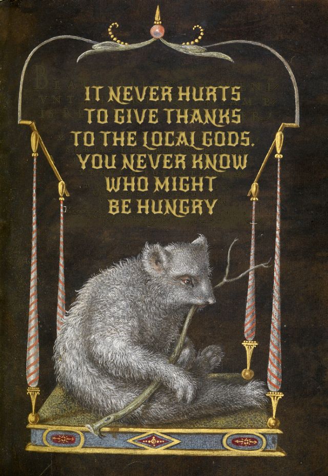the image is a painting featuring a bear holding a branch, sitting on a decorated platform. above the bear, in gold lettering, is the text: "it never hurts to give thanks to the local gods. you never know who might be hungry". the artwork is framed by stylized architectural elements with gold accents. the background is a dark brown or black color. the overall style resembles medieval or early modern art with elements of fantasy.
