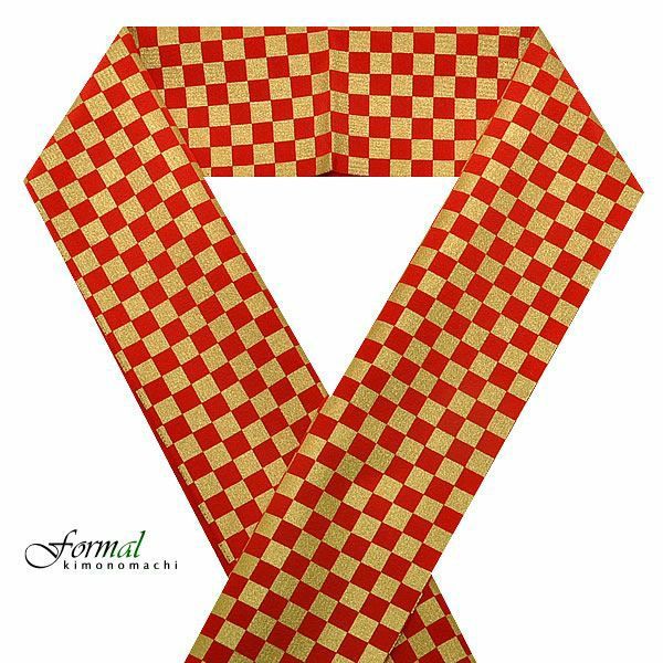 a red and gold checkered ribbon, possibly a kimono accessory, is arranged in a vshape against a white background. the brand "formal kimonomachi" is visible in the bottom left corner.
