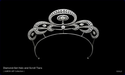a silver and diamond tiara on a black background.  the tiara has a halo design with scrolls and is made of round brilliant cut diamonds. the tiara is part of the albion art collection.
