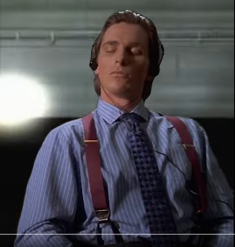 a man with slickedback hair wearing a blue pinstriped shirt, red suspenders, and a patterned tie sits with his eyes closed while wearing headphones. he appears to be calm and possibly listening to music. the setting appears to be an office with bright, artificial lighting.  the image evokes a sense of 1980s corporate culture.