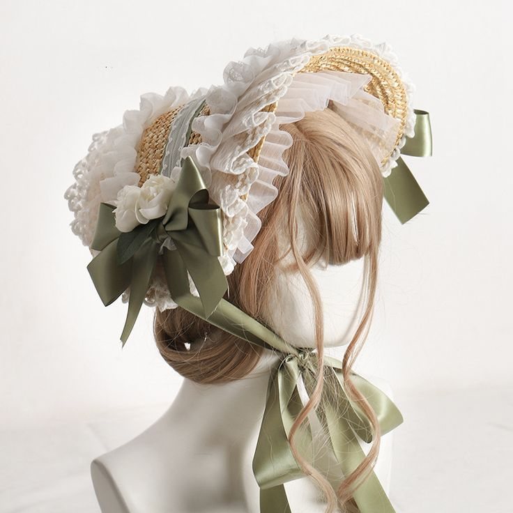 loseup view of a beautiful straw bonnet adorned with delicate white lace and a soft green ribbon.  the bonnet is decorated with small, white fabric flowers. it is displayed on a mannequin head with light brown, wavy hair. the style is reminiscent of vintage or lolita fashion. the overall impression is one of elegance and femininity. the background is a plain white, providing a clean backdrop that allows the hat to stand out.