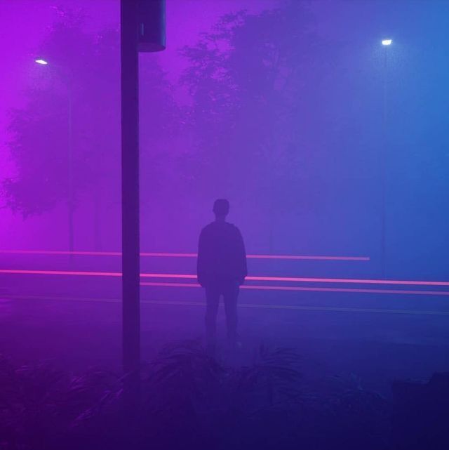 a silhouette of a man standing in the middle of a foggy street. the street lights are on in the background, casting a purple and blue glow on the scene. the fog creates an atmosphere of mystery.