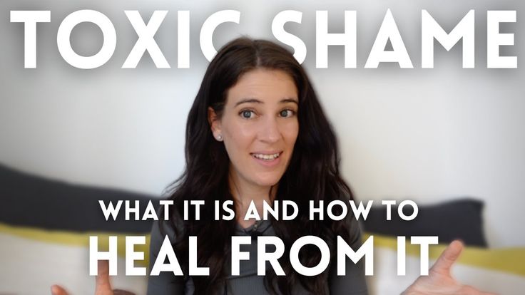 a woman with dark hair is in the center of the image, in front of a white background. above her head is the text "toxic shame" in large white letters. below her is the text "what it is and how to" in smaller white letters, followed by "heal from it" in slightly larger white letters. the image appears to be a thumbnail or promotional image for content related to toxic shame and healing.