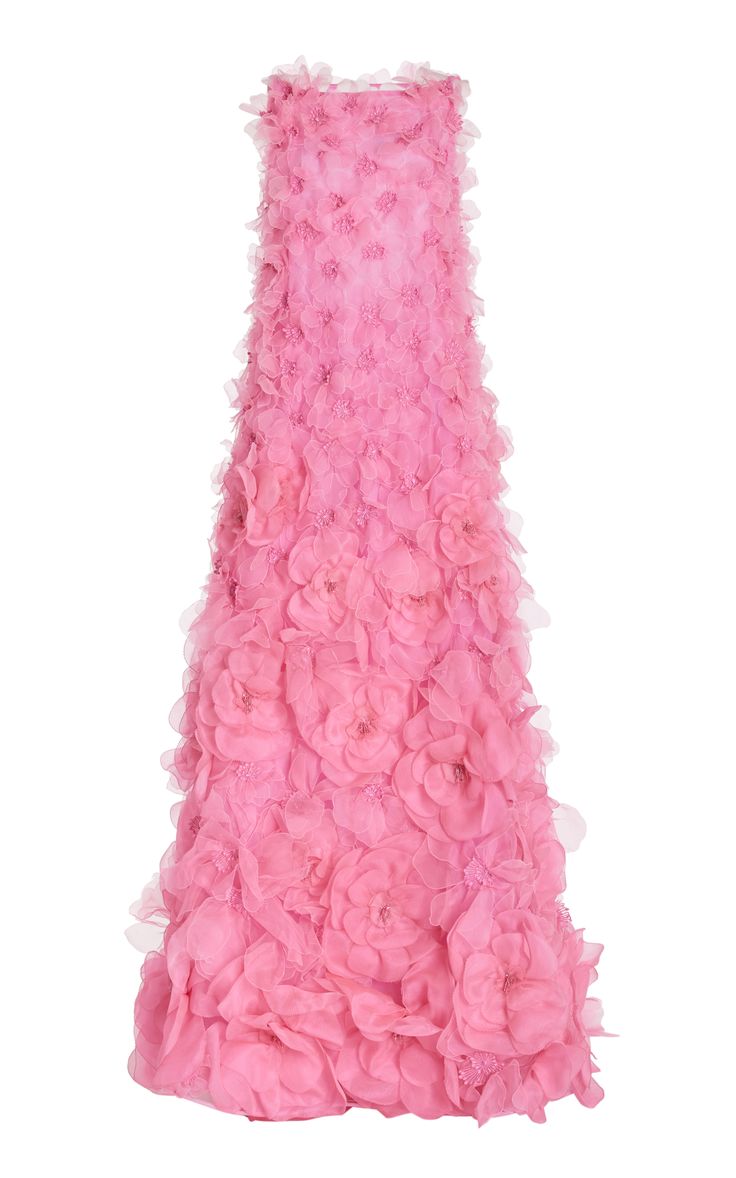 a beautiful pink dress with a floral design. the dress is strapless and has a layered, textured look. it would be perfect for a special occasion or evening event.
