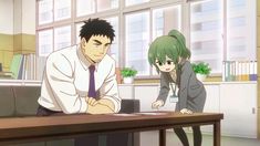the image showcases a scene from an anime or manga, likely within an office environment. a tall, muscular man with short black hair and a stern expression leans on a desk, facing a petite woman with green hair tied in a ponytail. she appears to be explaining something to him, pointing at a document on the desk.  the bright lighting suggests a daytime setting, possibly near a window, contributing to the overall cheerful and lighthearted atmosphere.  the scene hints at a possible workplace relationship, potentially developing into a sliceoflife romantic story.