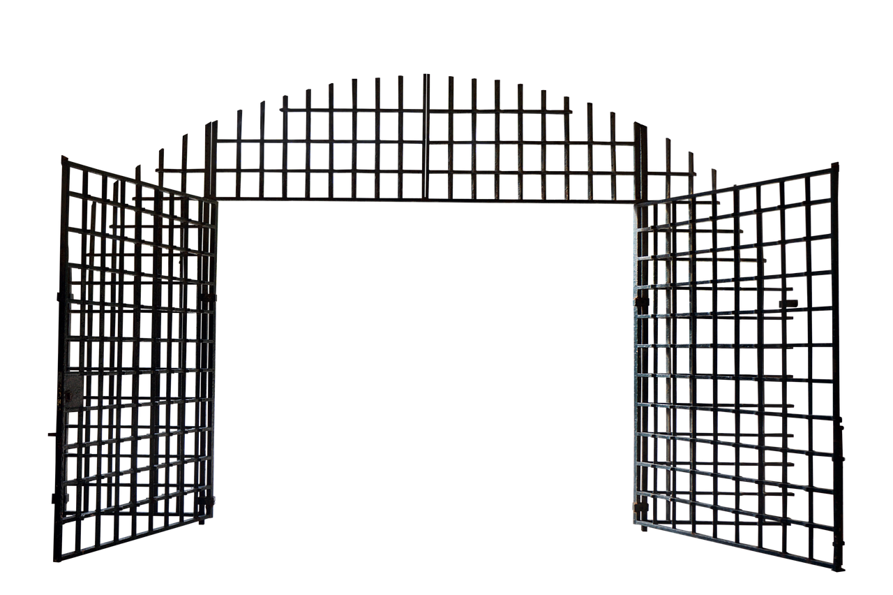 a metal gate, possibly a prison or jail gate, is shown open against a dark or black background. the gate has an arched top and is made of thick metal bars forming a grid pattern. the gate is open to the sides, revealing only blackness beyond. the scene is dimly lit, with light catching the edges of the metal bars.