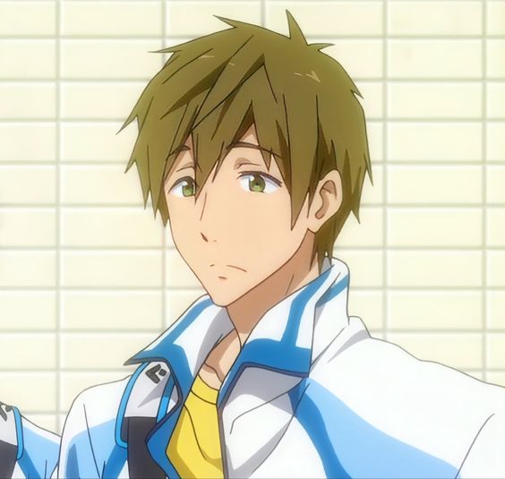 a headandshoulders illustration of a young man with brown hair and green eyes. he has a thoughtful expression. he wears a white jacket with blue trim over a yellow shirt. the background suggests he is inside a building, perhaps a school, with pale green tiles on the walls.  the lighting is bright and soft, giving the image a gentle feeling.