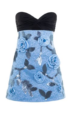 a blue strapless dress with a black top and floral embellishments. the dress has a sequined fabric with light blue roses and green leaves. the dress is a cocktail dress and is perfect for a party or summer event.