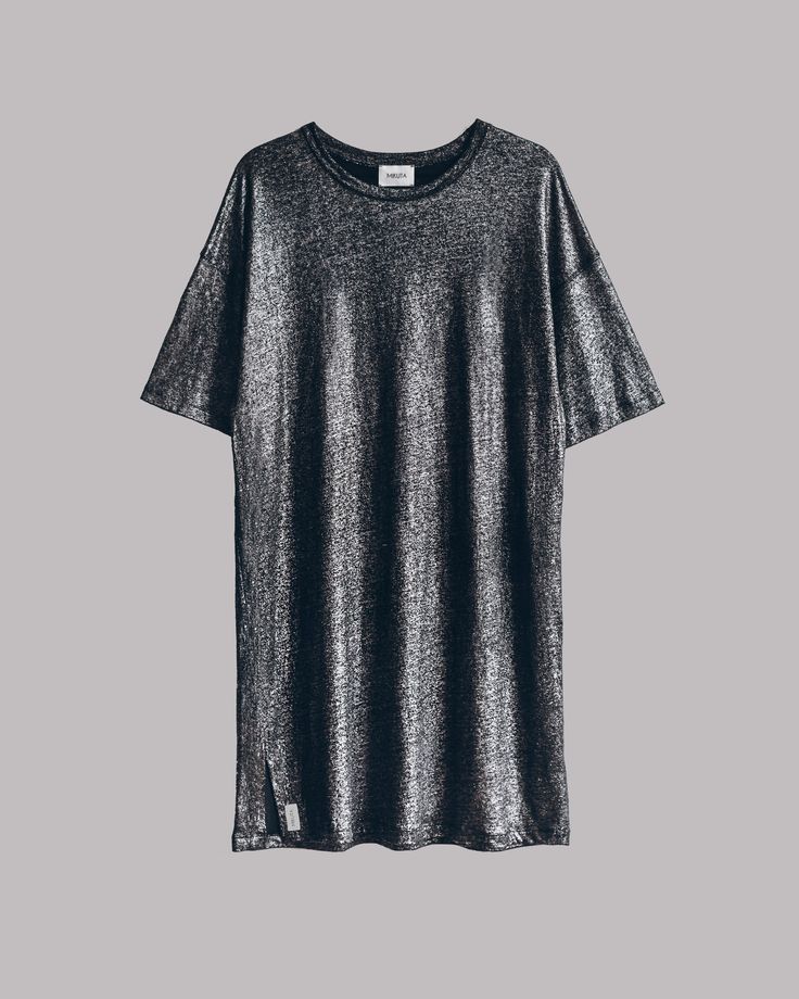 a silver metallic tshirt dress with short sleeves. the dress is on a gray background. it is a casual and stylish look.