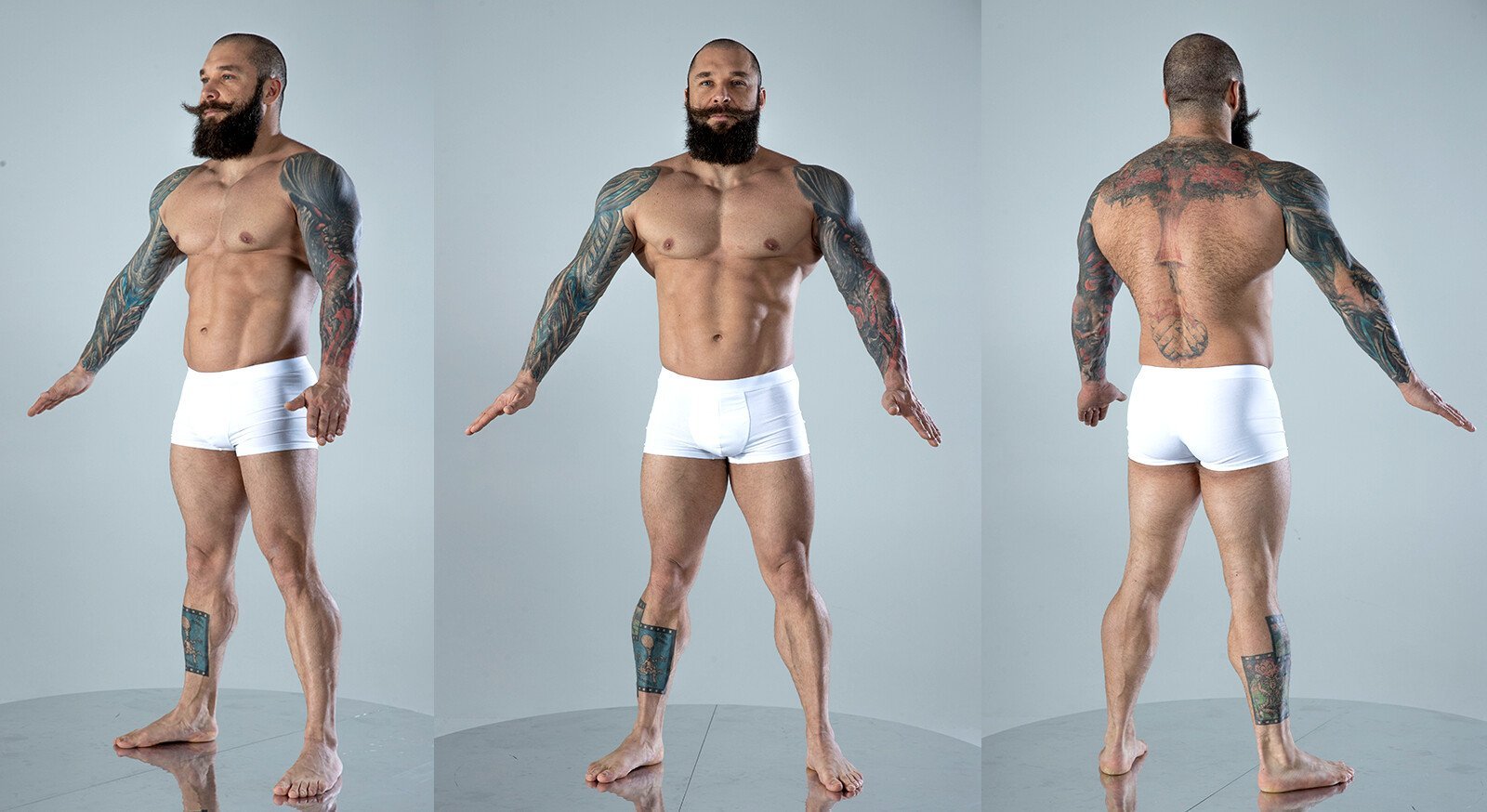 a muscular man with a beard and tattoos is posing in white boxer briefs.  he is shown from the front, back, and side, showcasing his physique. he is standing in a studio, against a gray background.