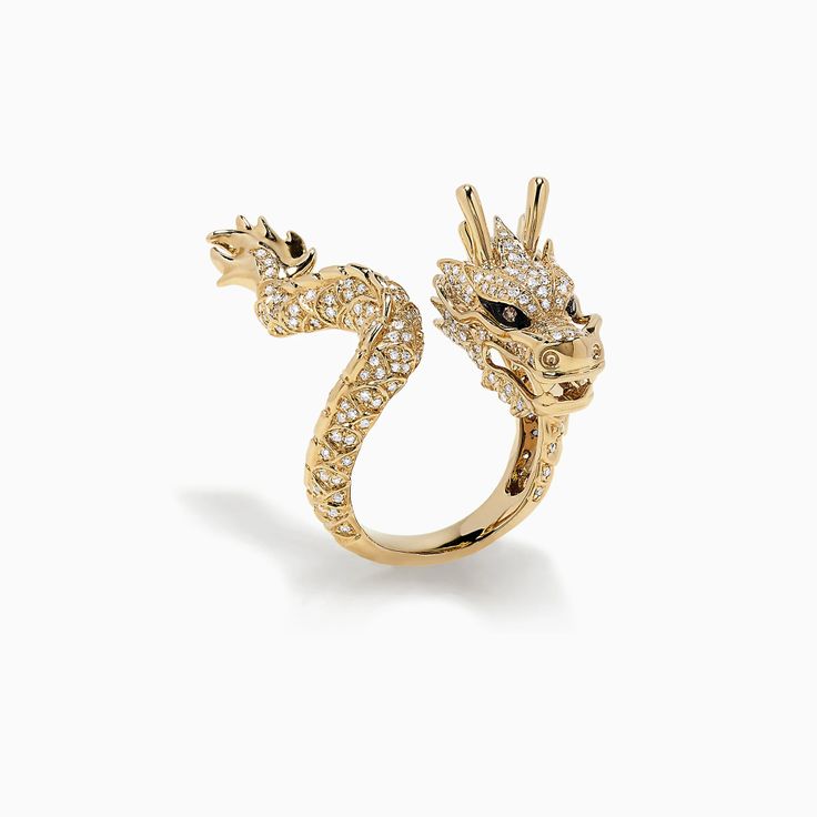 the image shows a gold ring shaped like a dragon, heavily embellished with diamonds. the dragon's head is prominent, with detailed features and black eyes. the body curves around to form the ring band, also covered in diamonds.