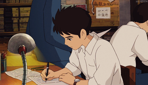 the image shows a young boy sitting at a desk and deeply engrossed in his writing. he is illuminated by a desk lamp that casts a warm glow on his work. the surrounding environment suggests a classroom or library, with bookshelves visible in the background. the overall atmosphere is one of quiet concentration and focus.
