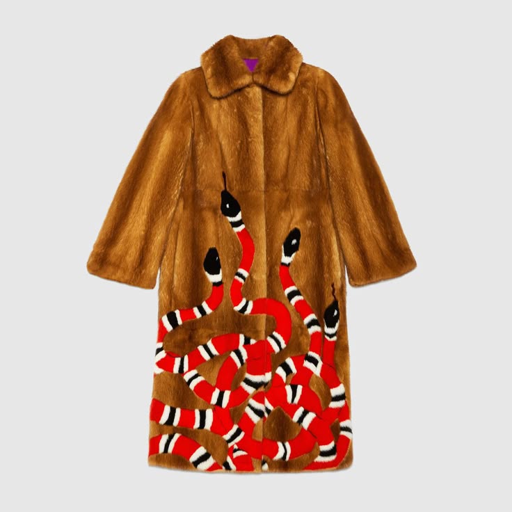 a brown fur coat with a red, black, and white snake pattern on the lower portion of the coat. the snakes have black heads and the body is covered with red and white stripes. the coat has long sleeves, a collar, and a light purple lining.