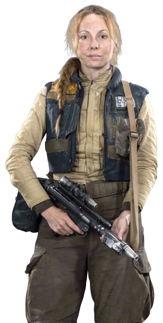 a woman dressed as jyn erso from star wars rogue one is holding a blaster rifle and looking at the camera. she is wearing a brown and blue vest, brown pants, and has brown hair.