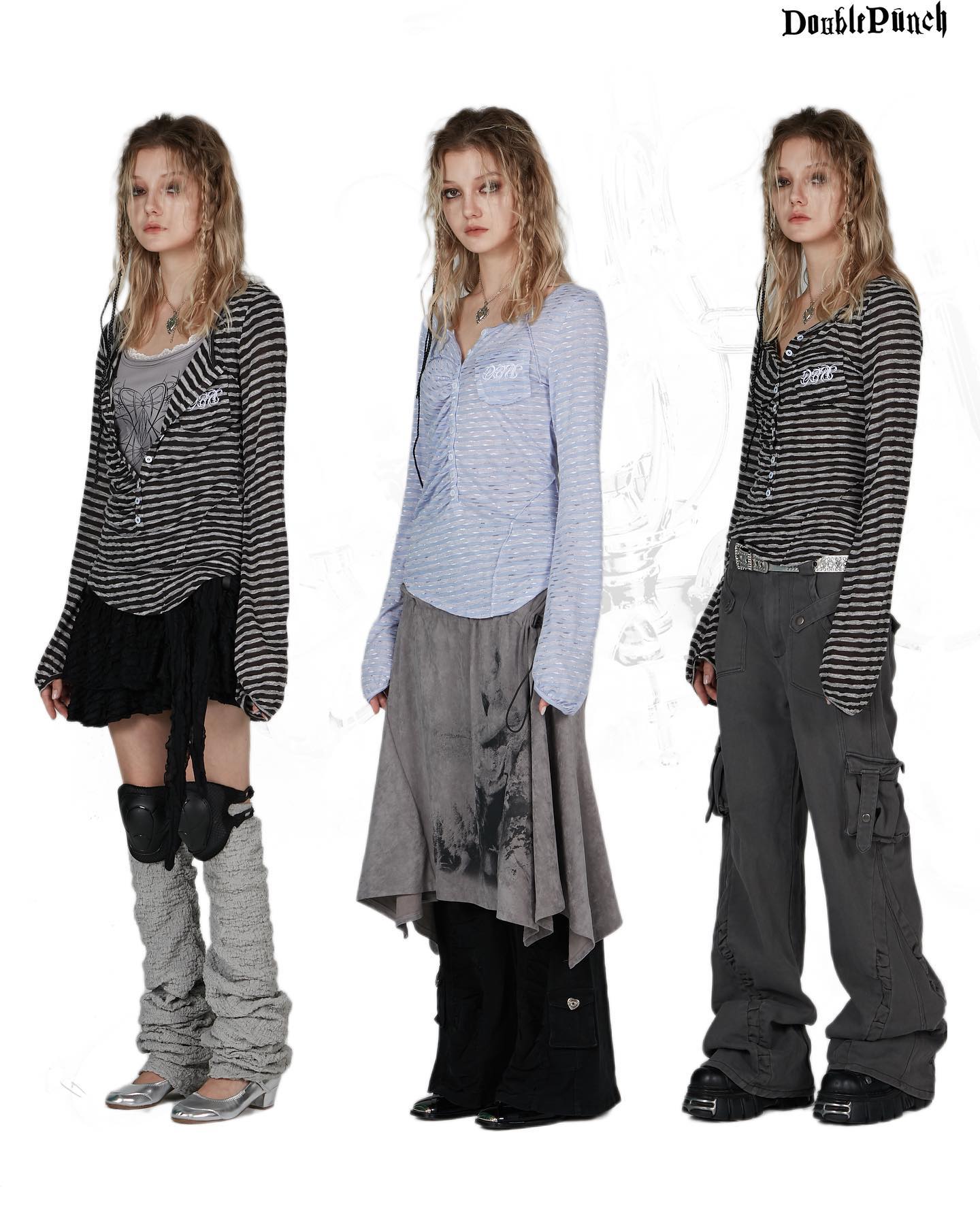 the image shows three female models showcasing different outfits from the double punch clothing brand.  each model is wearing a longsleeved shirt – one in black and white stripes, one in light blue stripes, and one in black and white stripes – paired with various bottoms.  one model wears a black skirt and grey leg warmers, another a grey asymmetrical skirt layered over black pants, and the third model wears loosefitting grey cargo pants.  the overall aesthetic is grunge or alternative fashion, with a touch of gothic style. the background is simple white, focusing attention on the clothing and the models.