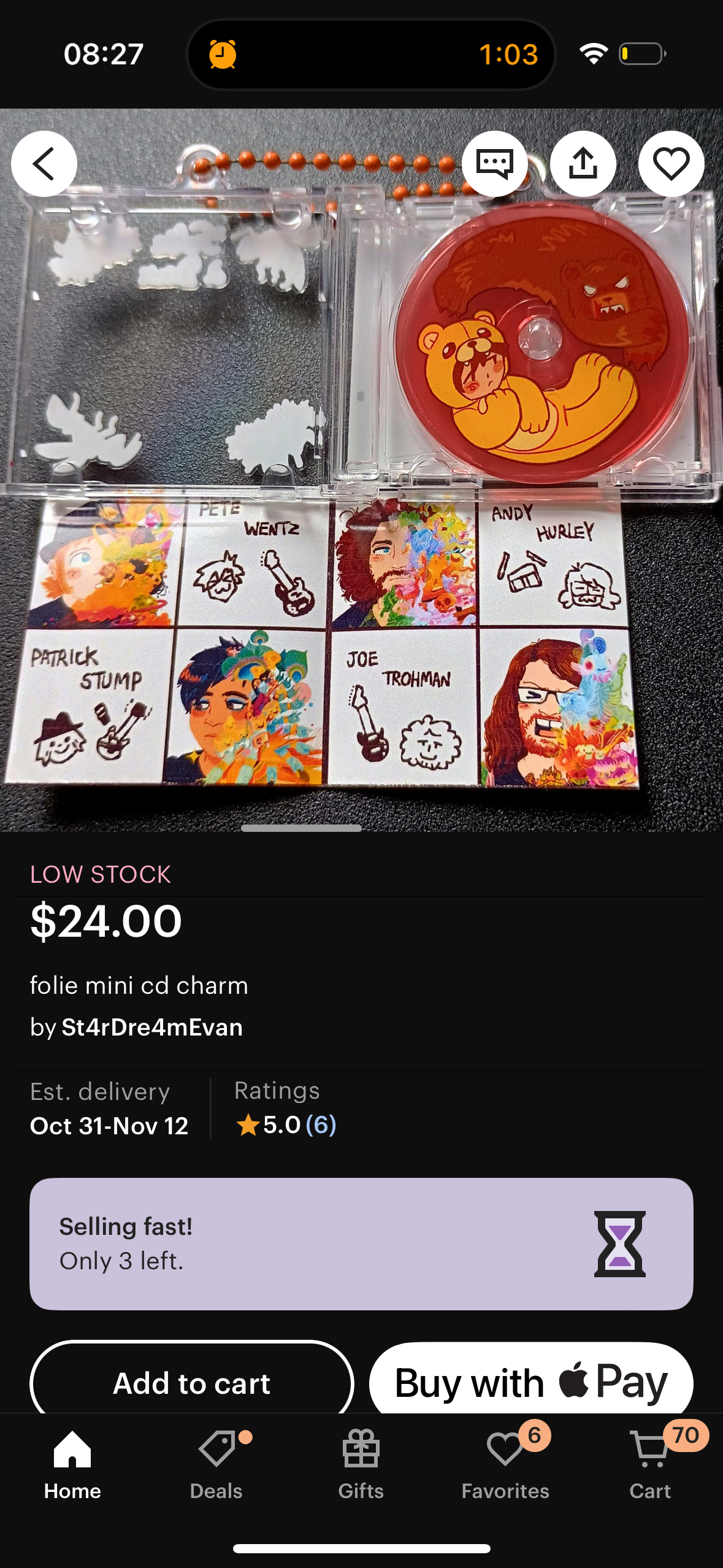 a product listing on an online shopping app, featuring a foiled mini cd charm of the band "fall out boy." the product features an image of each member of the band on different sides of the charm. it's described as a "rare" collectible and is "selling fast," with only 3 left. the image is on a black background, and shows the product, the price, and the quantity remaining in stock. the "add to cart" and "buy with pay" buttons are also visible at the bottom of the image.