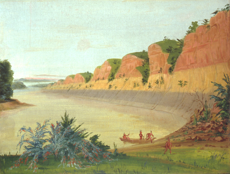 the image is a painting depicting a river landscape. the river flows from left to right, with a line of high cliffs along the right bank. these cliffs are layered with reddishbrown rock at the top and yellowish rock at the base. greenery and trees dot the top of the cliffs. in the river, a small boat carries three indigenous figures. on the grassy shore near the cliffs, another indigenous figure is walking. in the foreground on the left, there are shrubs. the sky is light blue with a hint of white, and the overall scene evokes a sense of peacefulness and natural beauty.