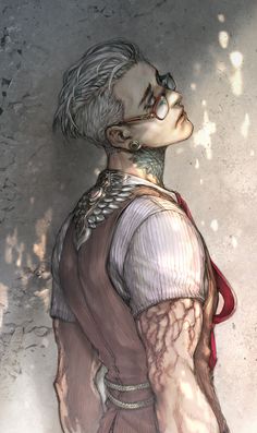 the image shows a stylishly dressed man from a low angle. he is looking up towards the left, and light is coming from that direction, casting soft shadows on his face. he has undercut white hair, and he's wearing round glasses. he also has tattoos on his neck and arm and is wearing a red tie. the background of the image is a textured, gray wall.