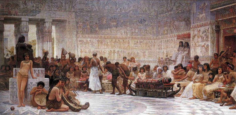 the painting depicts a scene from ancient egypt, likely a funeral procession. it takes place within the interior of a temple or palace, characterized by columns and walls adorned with hieroglyphs and murals. many people are present, ranging from figures in egyptian attire to slaves and musicians. a sarcophagus is being carried by slaves, and musicians play harps and drums. the scene depicts egyptian customs and architecture.