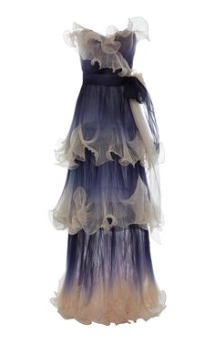 a long, flowing ombre dress with ruffles and sheer tulle, perfect for a formal event or wedding.