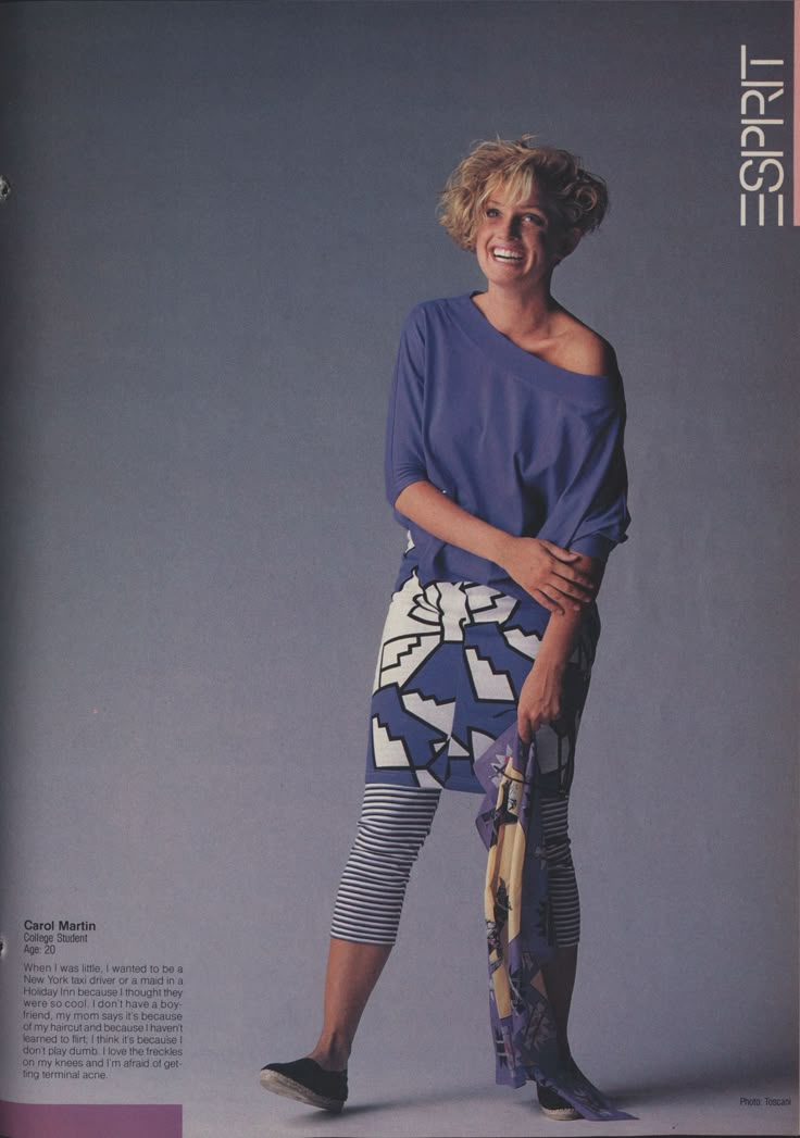 a vintage fashion advertisement for esprit, featuring carol martin, a young woman with short blonde hair smiling and posing in a colorful outfit. she is wearing a blue, offtheshoulder top, a white skirt with a blue geometric pattern, striped blue and white leggings, and black sneakers. she is also holding a patterned scarf. the background is a solid light gray color. the esprit logo is on the right side of the image. the text describing carol martin and her aspirations is on the left side of the image.