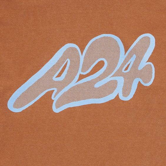 a closeup image of a brown tshirt with a stylized "424" logo in light blue. the logo has a graffitiinspired font and a textured fill.