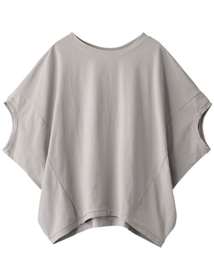 a grey, oversized women's tshirt with a round neck and short sleeves is displayed against a white backdrop. the top is made of cotton and appears to be a comfortable and casual wear item.