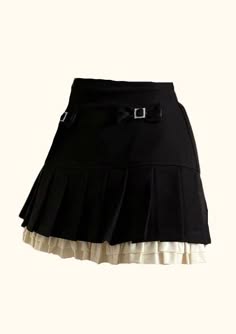 a black pleated mini skirt with a white lace trim and a black bow with a silver buckle.  the skirt is a fashionable piece of clothing for women.
