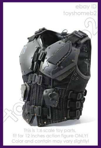 a closeup shot of a 1:6 scale black tactical armor vest for an action figure. the vest is made of plastic and has a variety of details, including straps, buckles, and pockets. it looks like it would be a great addition to any action figure collection.  it's a highly detailed accessory for any collector of action figures.