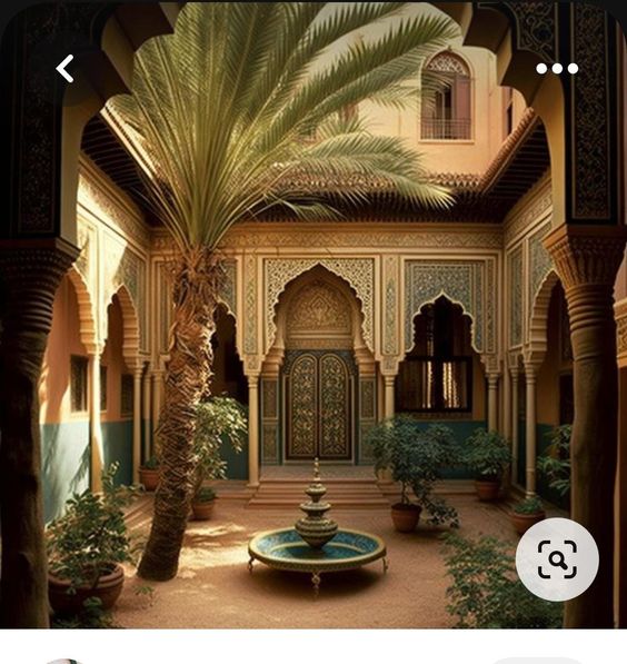 the image shows a traditional moroccan riad courtyard.  a palm tree grows in the center, surrounded by a tiled floor and a central fountain. ornate arches and colorful tiles create a stunning visual display.  sunlight illuminates the space, casting shadows that highlight the architectural details.