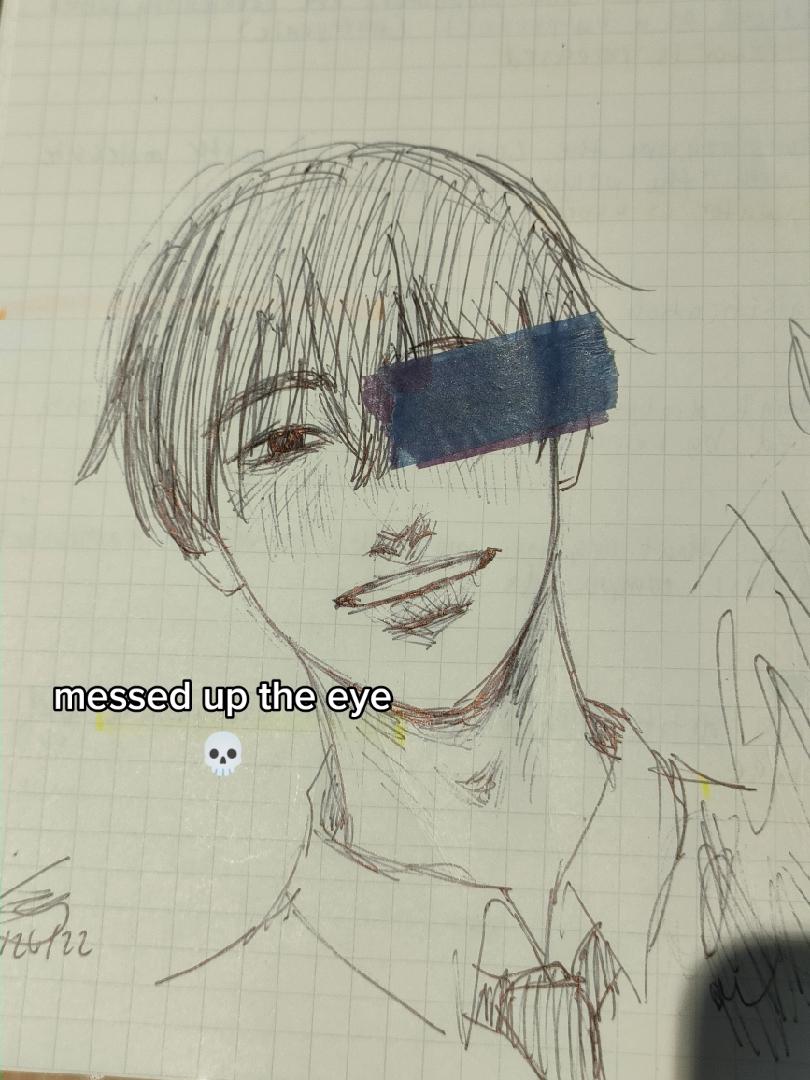 the image is a pencil sketch of a smiling young man on lined paper. he has short hair and is wearing a collared shirt.  a piece of blue tape covers his right eye, with the text "messed up the eye" and a skull emoji overlayed on the image. the lighting suggests the drawing was done indoors with natural light. the perspective is from a slightly low angle, looking up at the subject. the overall style of the sketch has an anime/manga influence.