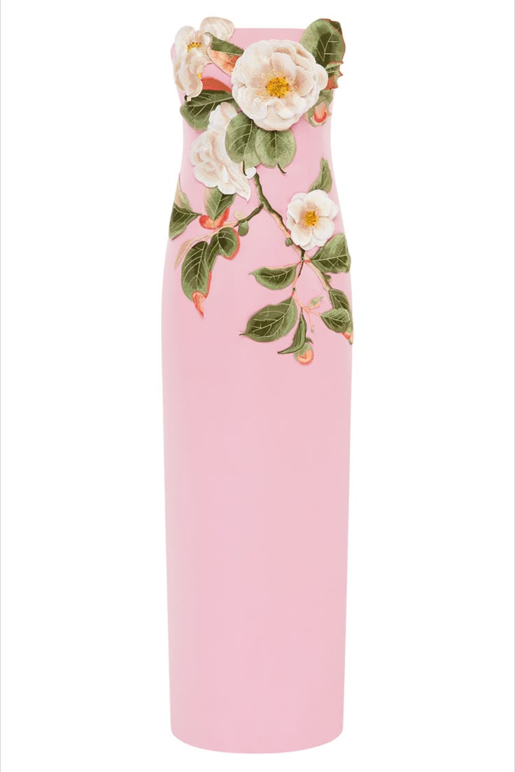 a strapless pink dress with white flowers and green leaves is displayed on a white background. the flowers are arranged on the upper part of the dress.