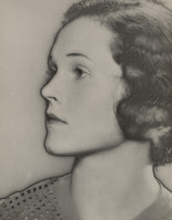 a black and white closeup portrait of a woman from the 1920s or 1930s. her face is in profile, turned slightly to the left, and she has wavy shoulderlength hair. the soft focus and lighting give the image a dreamy, timeless quality. she is dressed in what appears to be a patterned garment. the overall style suggests a vintage hollywood glamour aesthetic.