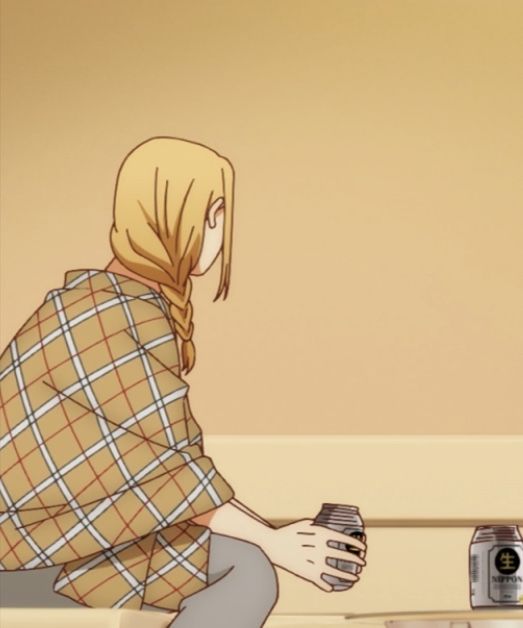 the image shows an anime girl with blonde hair sitting with her back towards the camera. she is wearing a plaid shirt and holding a drink in her right hand. there is another can of a drink on the table next to her. the background is a light orange color.