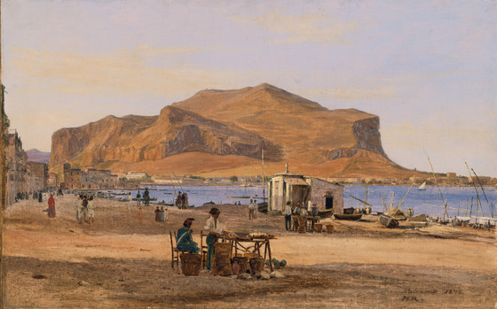this is a 19thcentury painting of a cityscape on a beach, likely depicting palermo, sicily. a large mountain dominates the background. in the foreground, people are seen along the shore and at a market stall. boats are drawn up on the beach, and buildings line the coast to the left. the sky is clear.