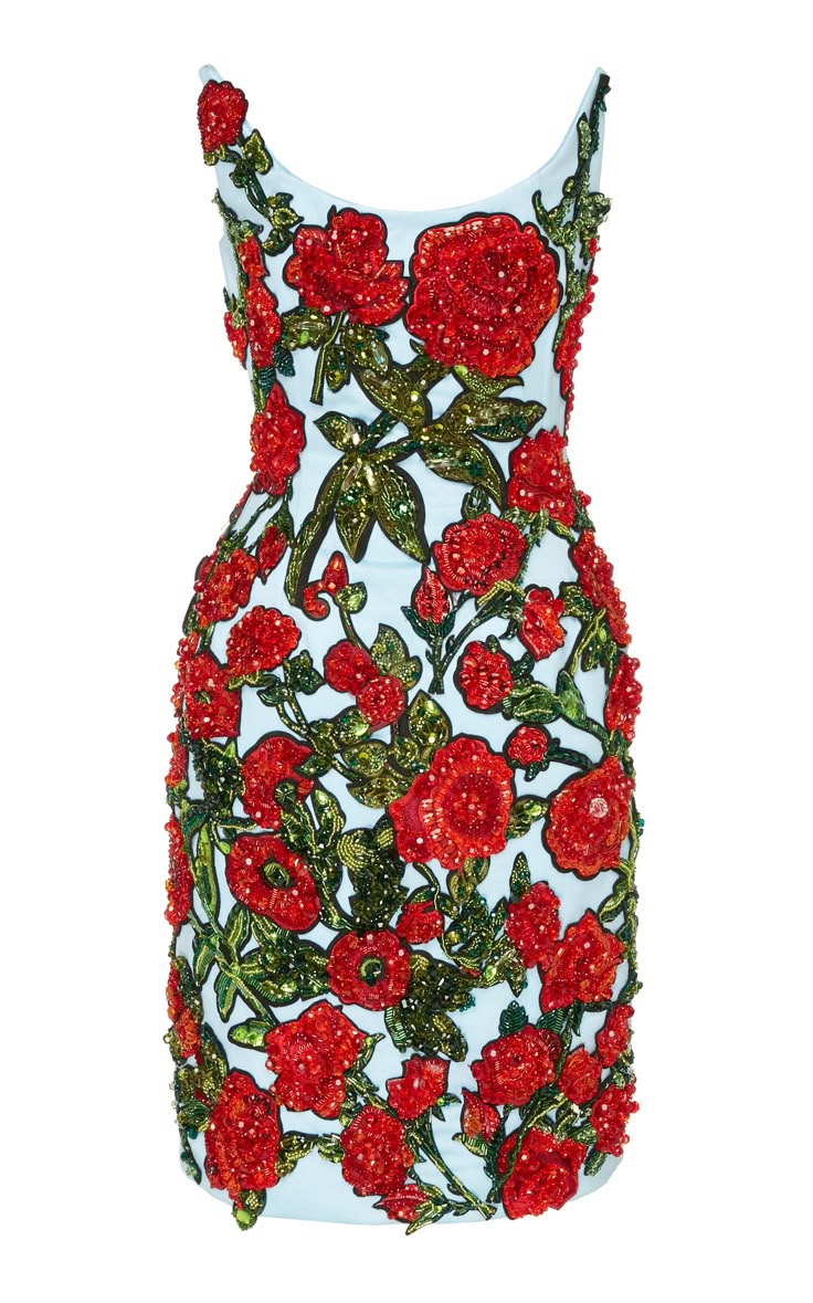 a fitted, sleeveless cocktail dress embellished with red roses and green and gold leaves. the dress is densely covered with floral embroidery, with a light blue base visible in some areas. the roses are bright red and beaded, giving the dress a textured, threedimensional look. the leaves are gold and green, adding contrast and detail to the design.