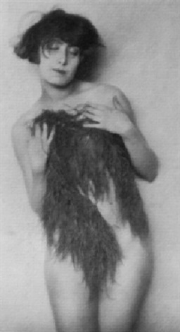 a black and white photograph of a woman, partially nude, holding a dark, feathery or fur garment around her body. she has a bob haircut and a soft, almost pensive expression on her face. the image is soft and subtly lit, with a vintage feel that suggests the 1920s era. the style is artistic and slightly sensual.  the overall mood is elegant and mysterious.
