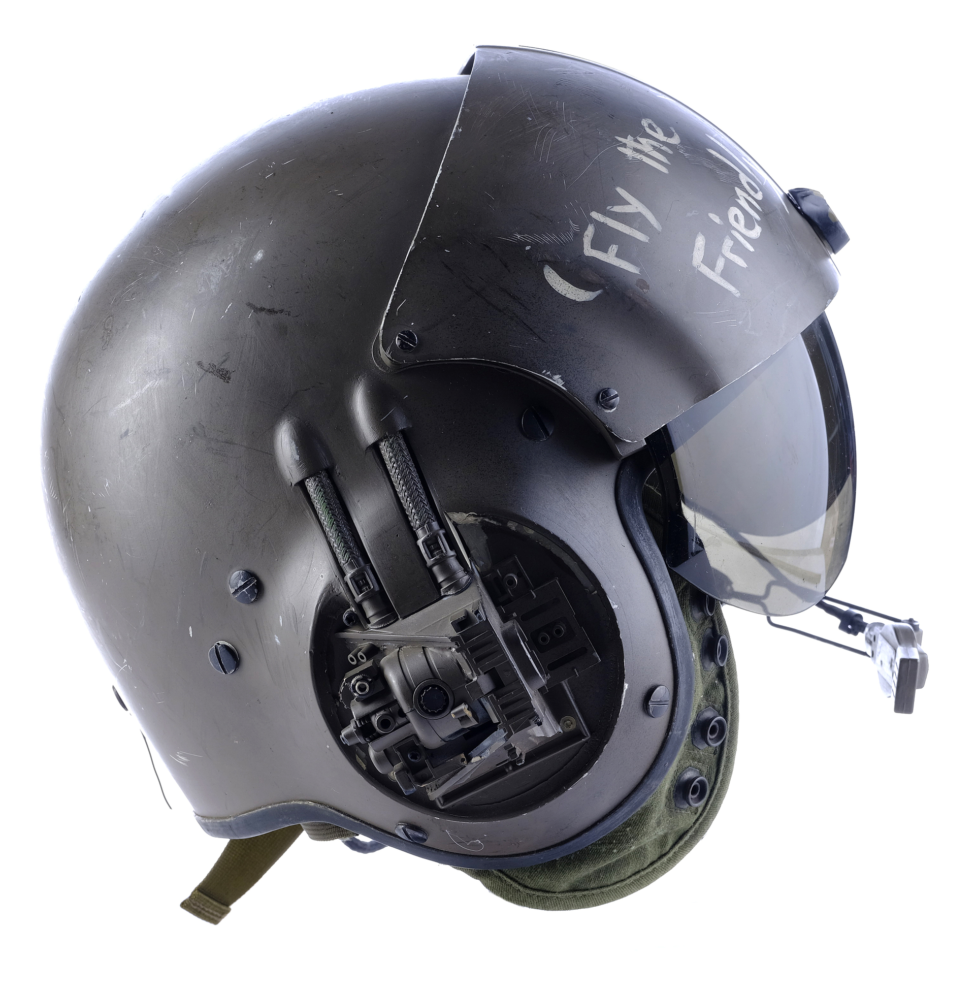 a closeup image of a military flight helmet, with the words "fly the friend" written on the side, signifying the importance of camaraderie and teamwork in aviation. the helmet is painted in a green camouflage pattern and features a visor, a headset, and communication equipment. it is a vital piece of safety gear for pilots and aircrew, providing protection and essential communication tools during flight operations.