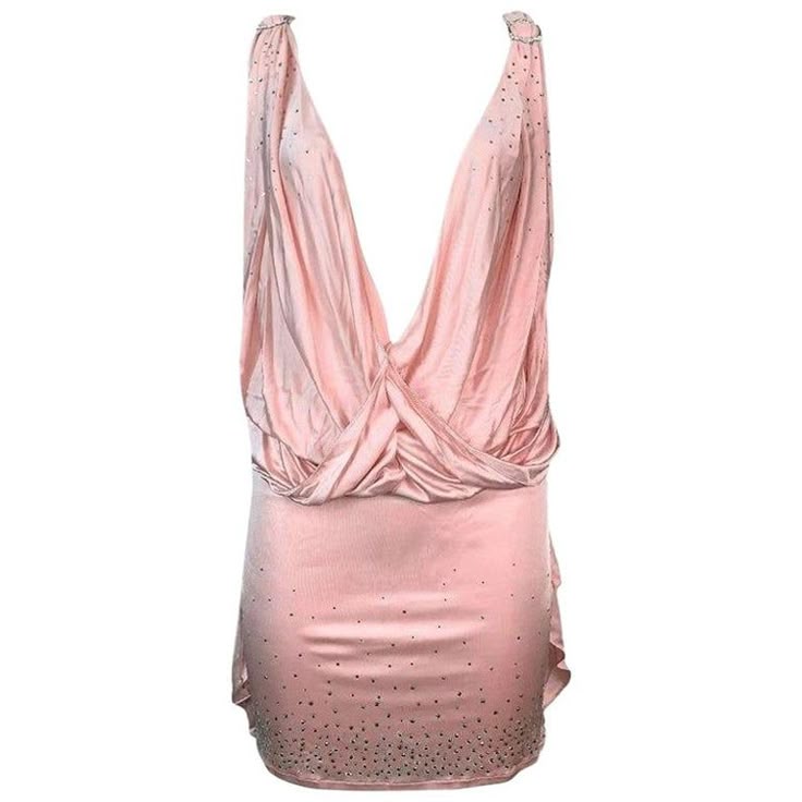 a pink sleeveless mini dress with a draped neckline and sequined detailing.
