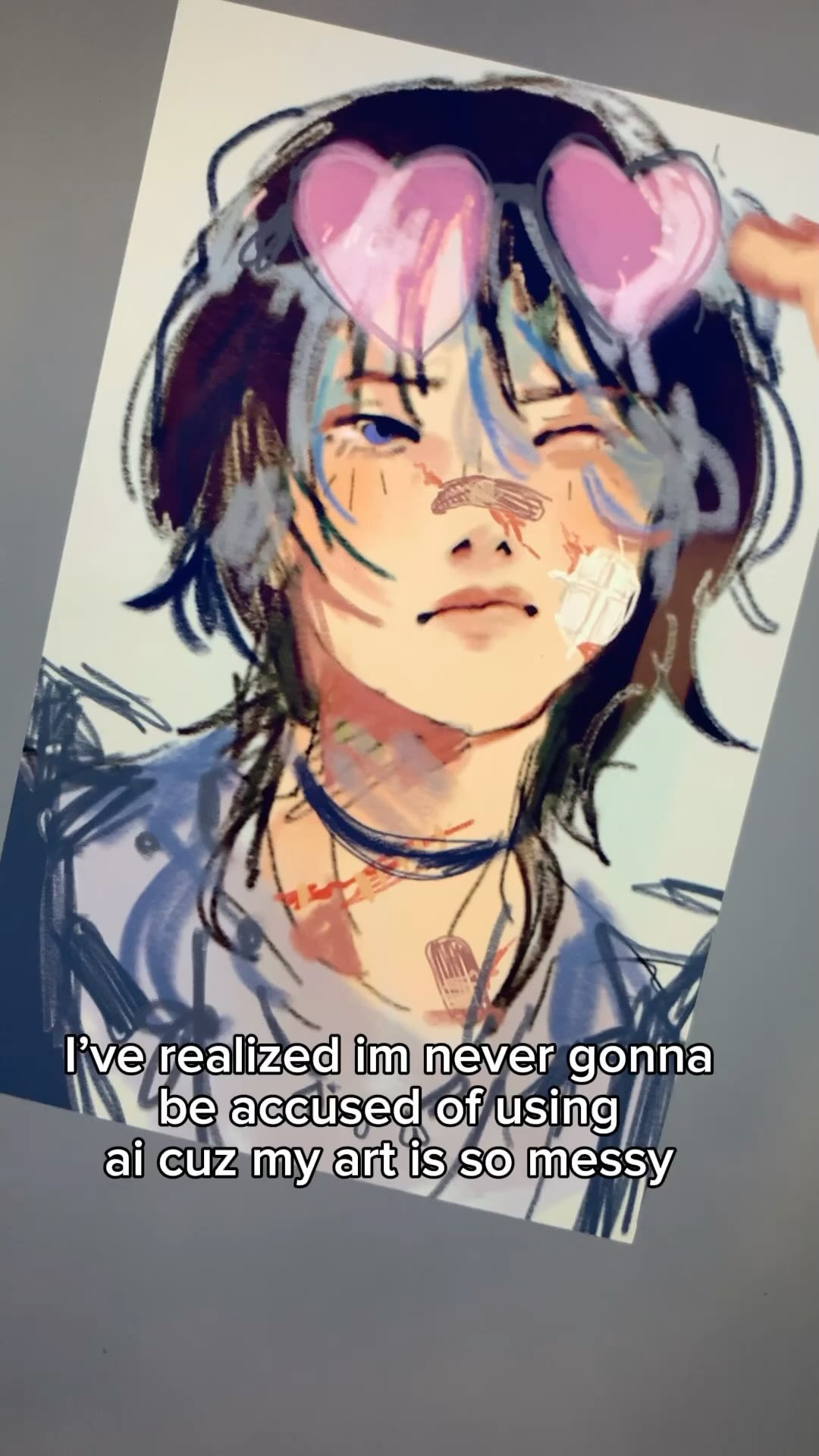 he image shows a digital drawing of an animestyle character with messy, expressive lines and strokes. the character has blue hair, is wearing heartshaped sunglasses, and appears to have bandages on their face. the art style is deliberately rough and unrefined, emphasizing the artist's unique handdrawn quality.  a caption on the image reads: "i've realized i'm never gonna be accused of using ai cuz my art is so messy," indicating the artist's selfawareness of their distinct style and its difference from aigenerated art.