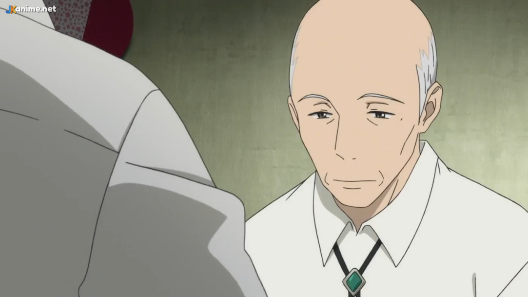 the image showcases a poignant closeup of an older, bald man with a solemn expression. his sadness is palpable, conveyed through his downcast eyes and the overall melancholic atmosphere. he's dressed in a white shirt, adorned with a distinctive greenstoned bolo tie, which adds a touch of subtle elegance to his attire. the soft lighting further enhances the mood of introspection and quiet sorrow.