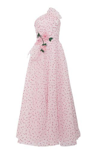 a light pink oneshoulder gown with a polka dot pattern and floral embellishments. the dress is sleeveless and falls to a maxi length.