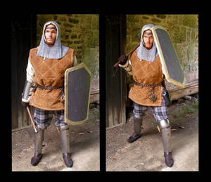 the image shows a diptych, or twopart image, featuring the same person dressed in medievalstyle attire. the individual is wearing a leather jerkin, chainmail coif, a kiltlike garment, and leg armor. they are holding a shield in one image and a pole arm (possibly a spear or halberd) in the other. the background suggests a historical setting, possibly a reenactment event or a location intended to evoke a medieval atmosphere. the individual's attire and props appear to be meticulously crafted, suggesting a dedication to authenticity or historical accuracy.