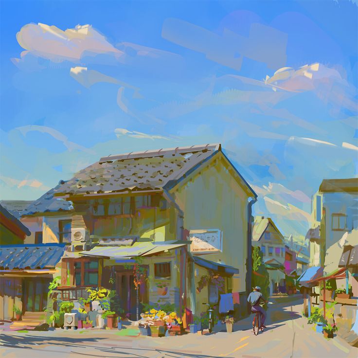 the image is of a street in japan on a sunny day. the street is lined with buildings, some of which are houses. there are plants and flowers in front of some of the buildings. a person is riding a bicycle down the street. the sky is blue with some clouds. the overall feeling of the image is peaceful and serene.