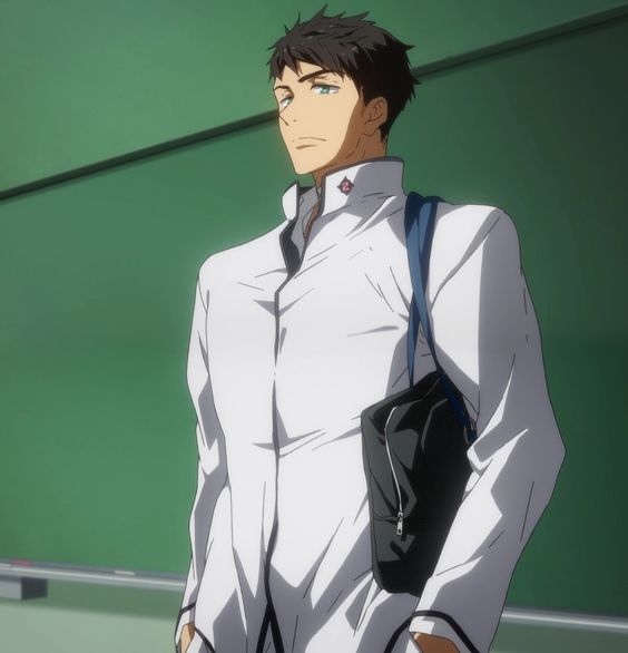 an anime male character with short brown hair and blue eyes wearing a white school uniform with a black trim and a black bag over his shoulder. he is standing in a classroom setting with a green chalkboard in the background.
